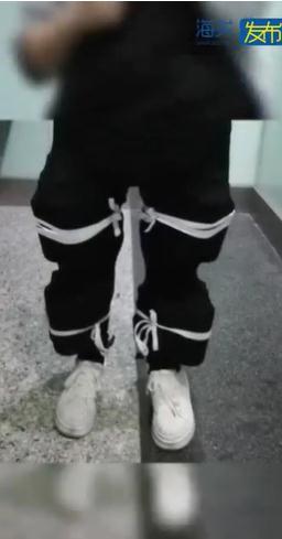 惊掉下巴！女子双腿绑14瓶茅台过关